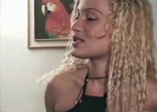 Two blond-haired bombshells and a horny dog